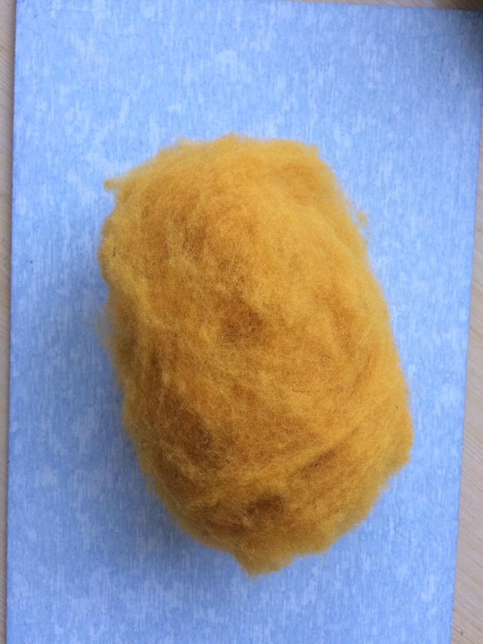 Ocher colored filling wool (100% wool)
